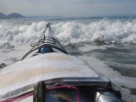 Dave Hay launching through surf