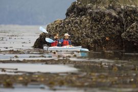 kayaking along the rocky shore