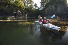 sea kayaking by sea arch