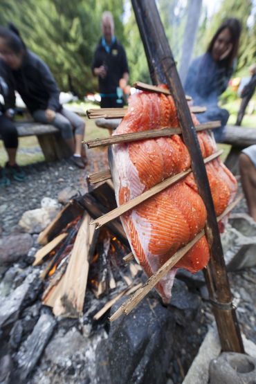 salmon cooking over the fire