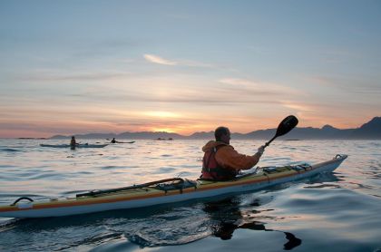 David Pinel kayaking with sunset