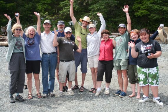 Happy group of guests on beach