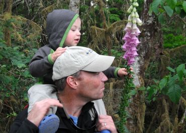 Dave Pinel and son Morgan looking at foxglove