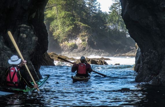 Liz kayaking through the arch at Spring Island