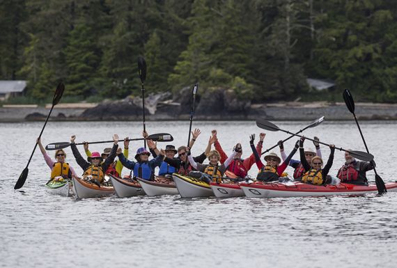Happy group of sea kayak paddlers