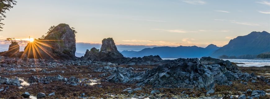 image by Robert Yone sparkling sunset over Brooks Peninsula