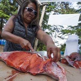 Lana Jules preparing salmon feast on Spring Island