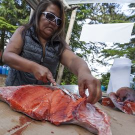 Lana Jules preparing salmon feast on Spring Island